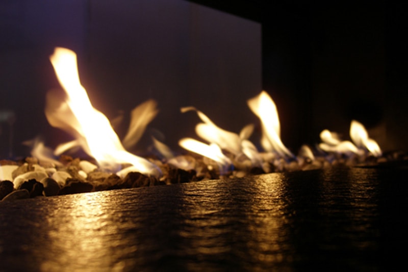 Gas fireplace with flames lit.