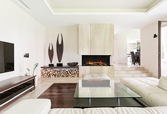 Electric linear fireplace in a modern white and beige living room.