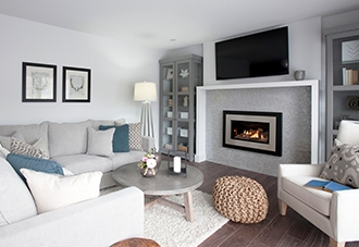 Gas insert fireplace in a modern light grey living room.