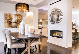 Gas linear fireplace in a modern dining room.