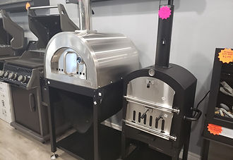 Pizza ovens lined up indoors.